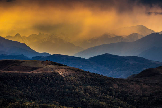 Great sunset with a view on mountain ridge and valley from Gumbashi mountain pass, Elbrus region, Russia