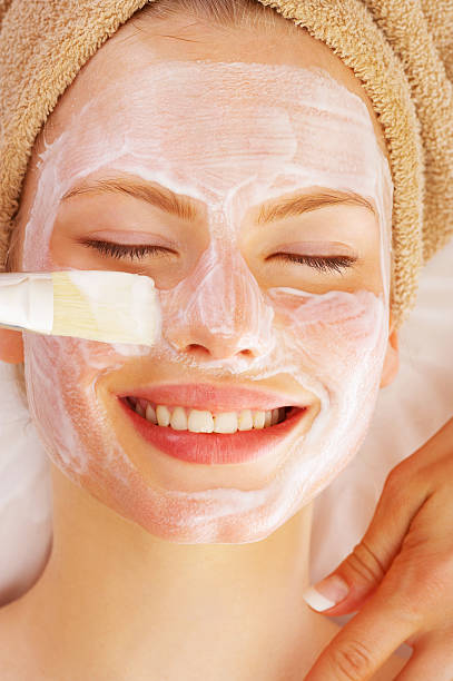 istock Attractive young woman getting a facial 144294843