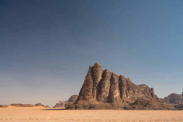Seven Pillars of Wisdom Mountain in Wadi Rum, Jordan Seven Pillars of Wisdom or Jabal al-Mazmar Mountain in the Desert of Wadi Rum, Jordan lawrence in arabia stock pictures, royalty-free photos & images