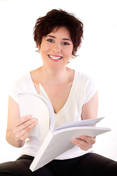 happy with books young girl with a book, high key, could be used for education and business concept presentation folder stock pictures, royalty-free photos & images