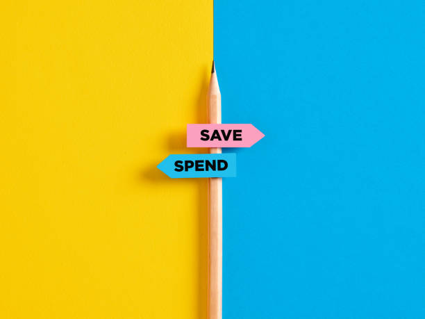 istock To save or to spend choice or decision. Pencil with direction indicator stickers showing the different decision paths to save or to spend money. 1442952737