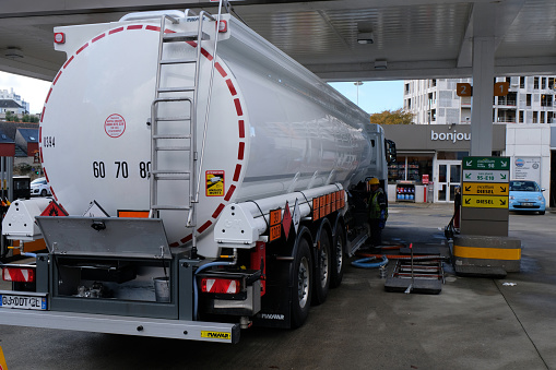 Vannes, France, november 18, 2022 : Tank truck refueling a TotalEnergies service station in the city of Vannes in Brittany