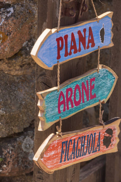 directional signpost to the Corsican village of Piana directional signpost to the Corsican village of Piana; Piana, France corsican flag stock pictures, royalty-free photos & images