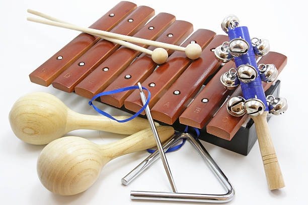 istock A pile of small percussion instruments on a white background 144295542