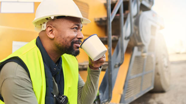 istock Coffee, engineer and construction worker relax on break at construction site, smiling and inspired by building idea and vision. Engineering, motivation and black man happy about project development 1442955731