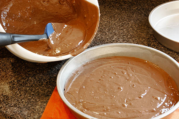 cake batter being prepared stock photo