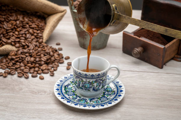 istock Pouring Turkish coffee from traditional coffee pot 1442958554