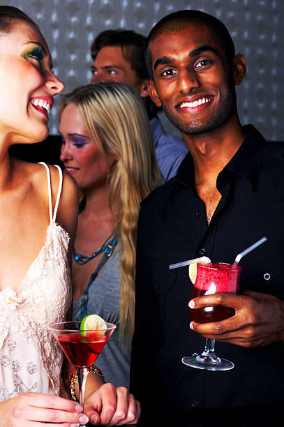 istock Friends enjoying cocktail party 144295862