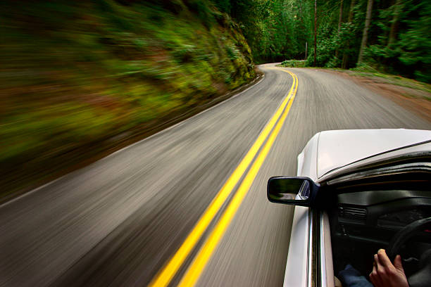 Car driving down windy road