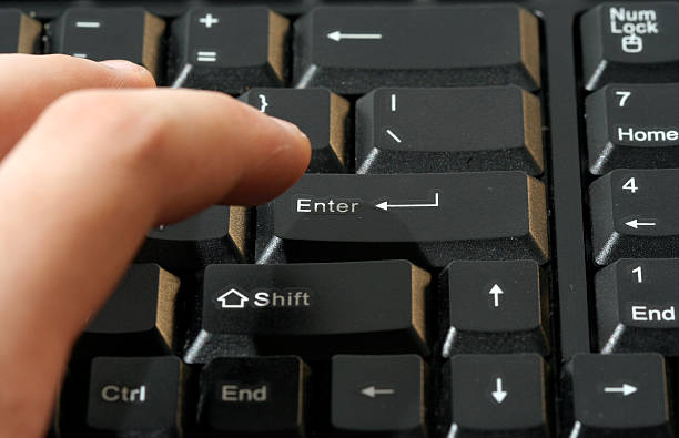 teclado de computador - enter key power single word winning - fotografias e filmes do acervo