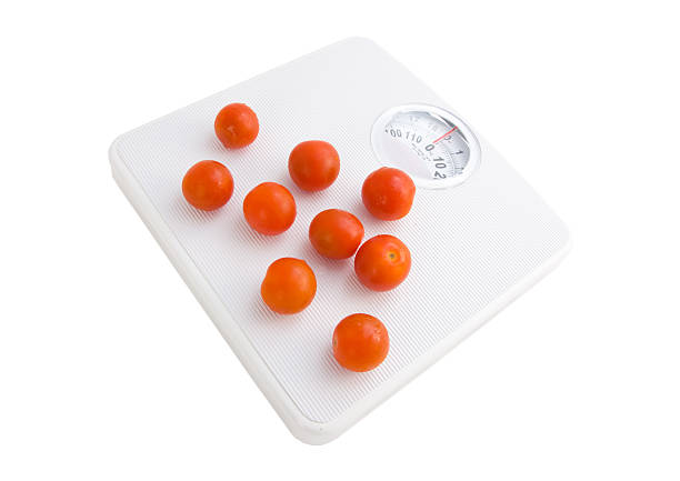 scales and tomatoes stock photo