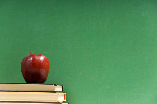 istock School books and chalkboard 144296646