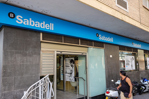 Malaga,Spain- October 24, 2022: The branch office of Sabadell Bank in Malaga. Banco de Sabadell, S.A. is a Spanish multinational financial services company.