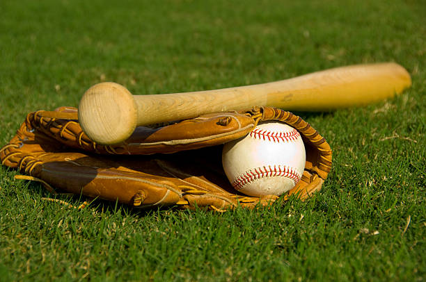istock Baseball, glove and bat on grass 144296696