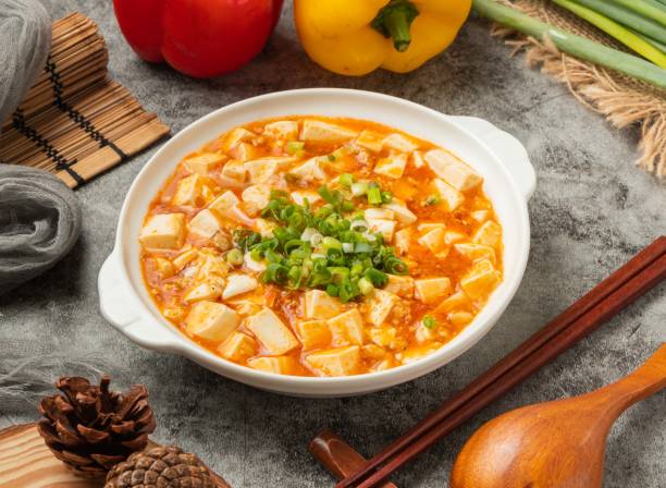 Mabo tofu with chopsticks served in dish isolated table top view of chinese food stock photo