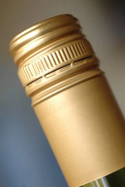 Screwcap capsule on wine bottle
