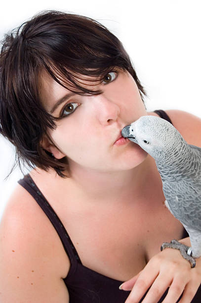 istock girl and parrot 144297014