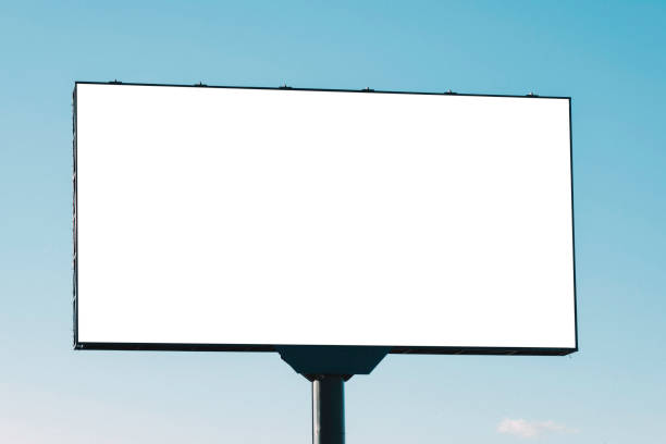 istock Large white blank billboard for outdoor advertisement, information board on blue sky background 1442972542