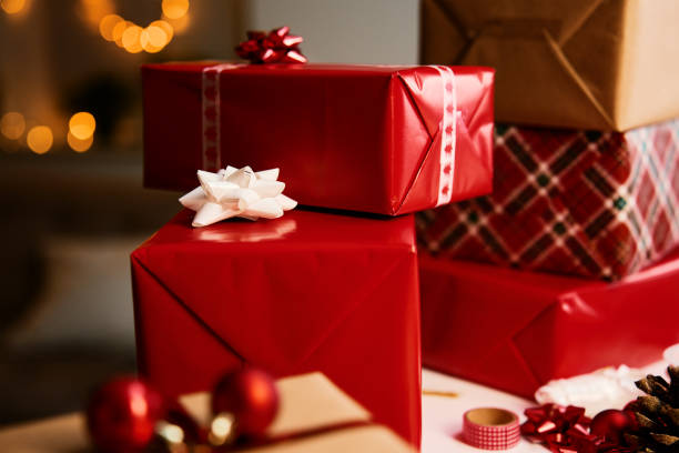 istock Pile of gift boxes wrapping in craft paper on table 1442972668