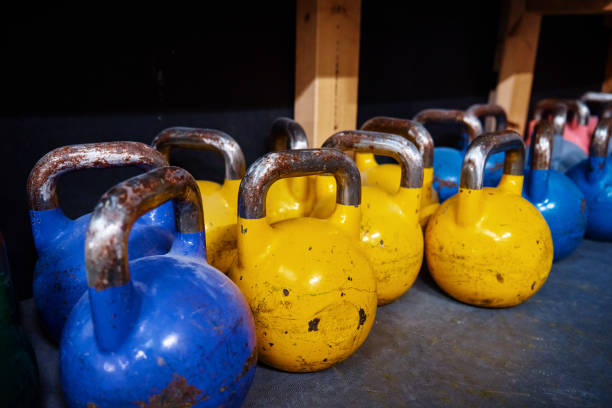istock Colorful kettlebells in gym on the floor 1442972699