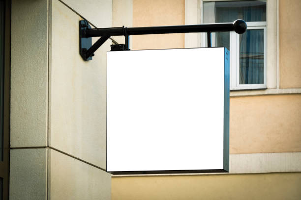 Mock up. Empty white rectangular signage on the wall of classical architecture building in European city stock photo