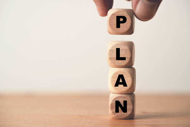 istock Hand putting wooden cube block for stacking plan wording concept. 1442975197