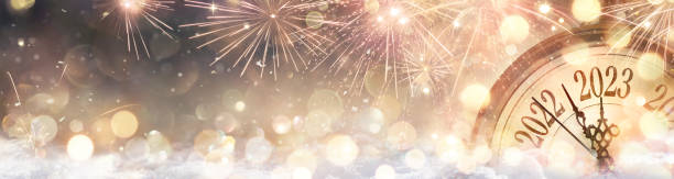 2023 New 2023 New Year Celebration - Golden Clock And Fireworks At Eve Night In Abstract Defocused Lights stock photo