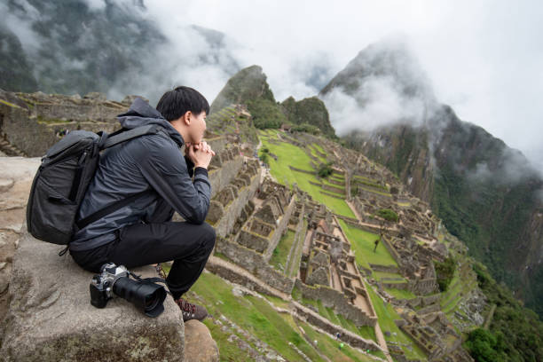 istock Asian man tourist looking at Machu Picchu 1442979057