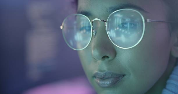 istock Glasses, reflection and coding business woman in neon office for cyberpunk, information technology and futuristic digital innovation. Eyes, vision and creative website design of a software developer 1442979986
