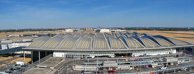 London, England - August 2022: Aerial panoramic view of the drop off zone and entrance to terminal 2, The Queen's Terminal, at London Heathrow airport