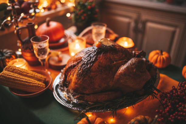 istock Thanksgiving holiday dinner table setting with fall decoration and pumpkins 1442980477