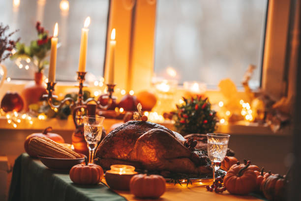 istock Thanksgiving holiday dinner table setting with fall decoration and pumpkins 1442980519