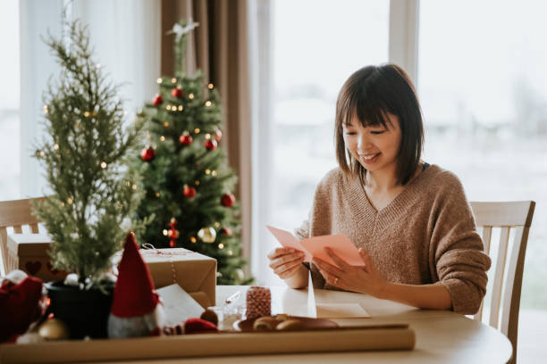 istock Woman reading Christmas letter 1442981629