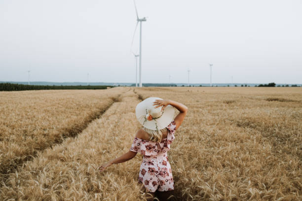 istock young woman in wheat field 1442981796