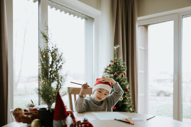 istock Boy writes a letter to Santa Clause 1442981826