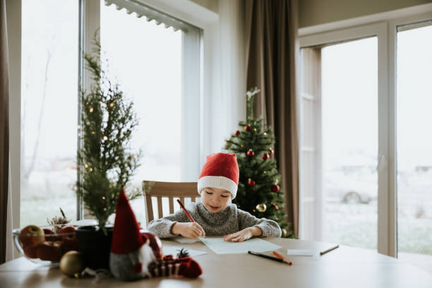 istock Boy writes a letter to Santa Clause 1442981831