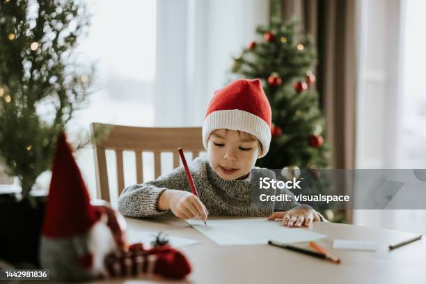 Boy Writes A Letter To Santa Clause Stock Photo - Download Image Now - Santa Claus, Letter - Document, Christmas