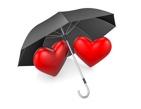 Hearts in love stand under an umbrella. Couple in love concept. Valentine's day background.
