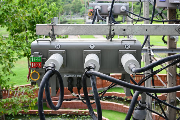 istock High voltage transformer on concrete pole, Three-phase transformers above road 1442982847