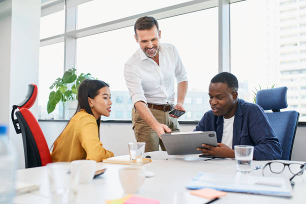 istock Diverse work colleagues discussing project during business meeting at office 1442988547