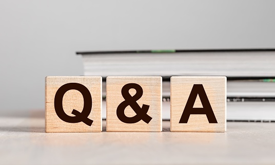 Q and A concept. QnA letters on wood blocks. Questions and answers. High quality photo