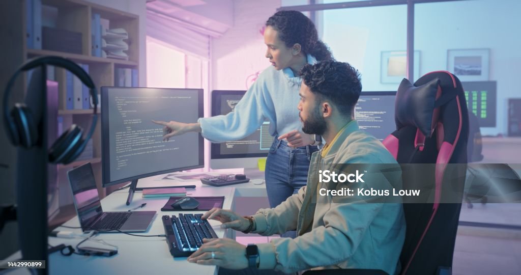 Programmer Coding And Team Talking About Software Data On Computer For ...