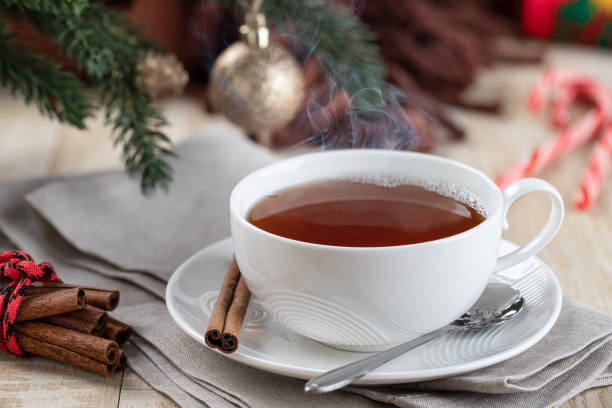 istock Steaming hot cup of tea with Christmas decorations 1442992029