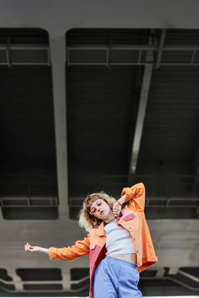 istock Young woman dancing urban 1442992375