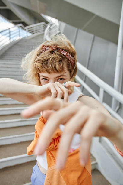 istock Trendy young woman dancing portrait 1442992415