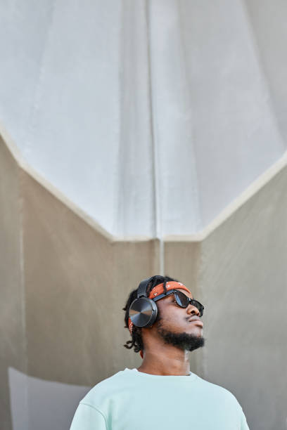 istock Young black man wearing headphones 1442992522