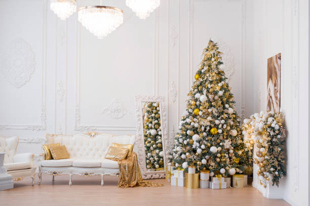 istock Interior of luxury interior with fireplace, comfortable sofa and chandelier decorated with Christmas tree and gifts 1443000810