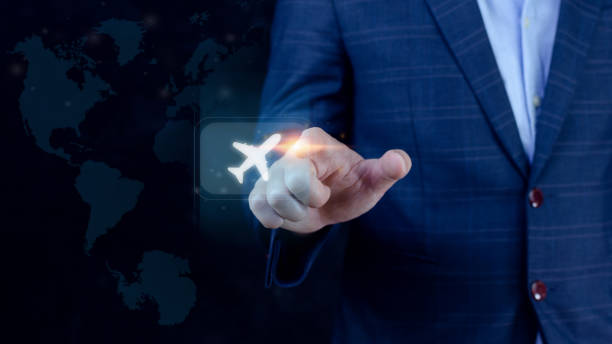 istock Businessman pointing finger touching to select flight by pressing touch screen airplane button with world map background,Business Airplane transportation concept 1443003357