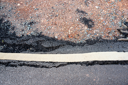 broken asphalt road detail image