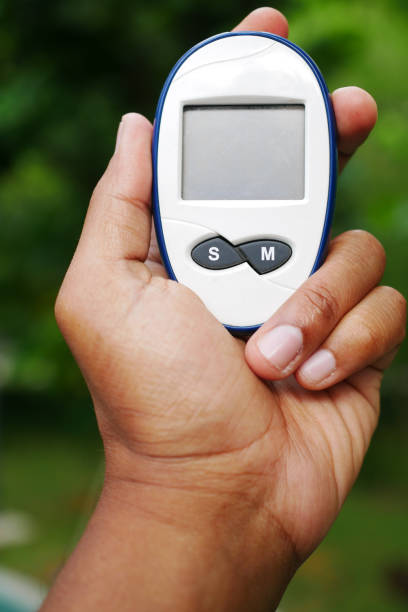 istock man's hand measuring blood sugar level 1443004814